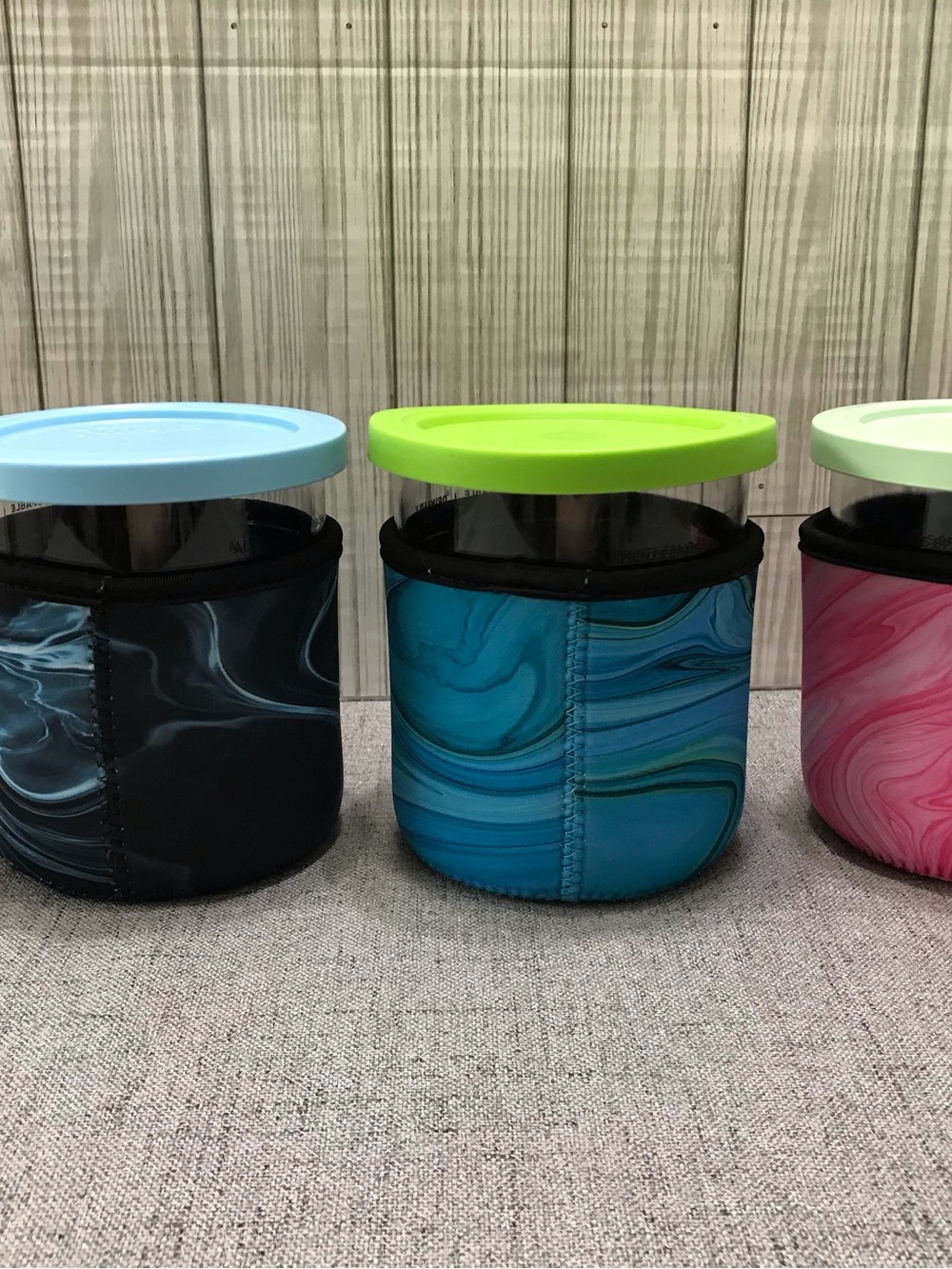 Set of Ninja Creami Ice Cream Pints and Insulated sleeves.